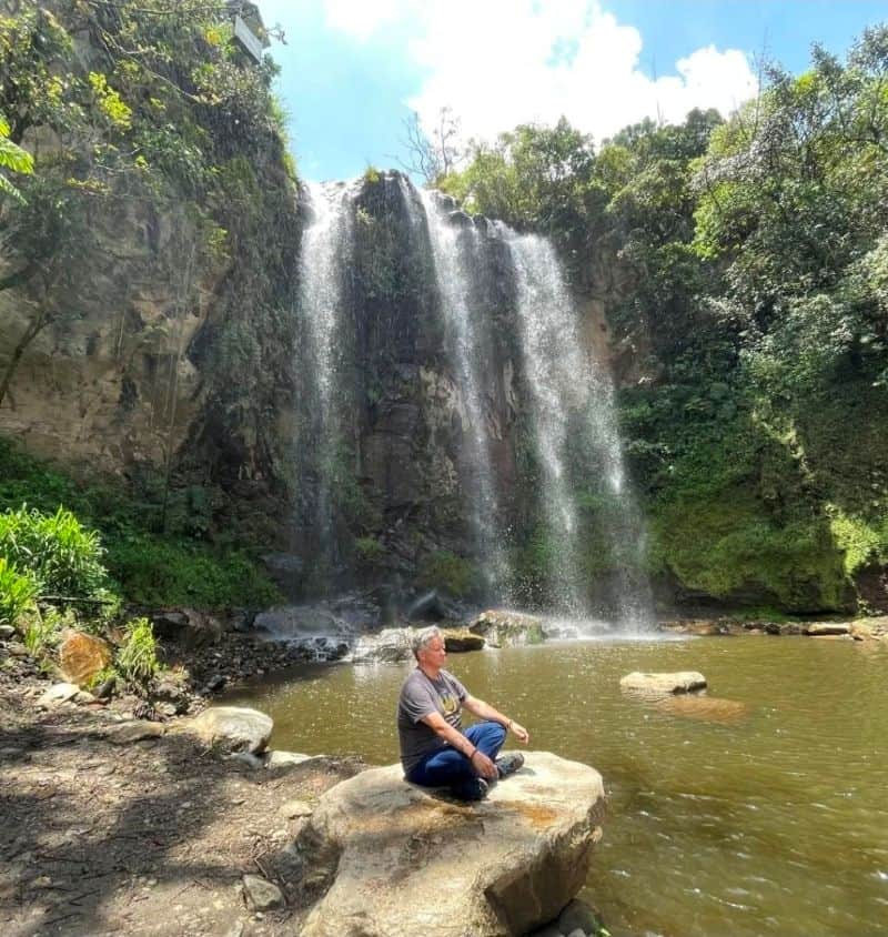 man at cascada silencio waterfall